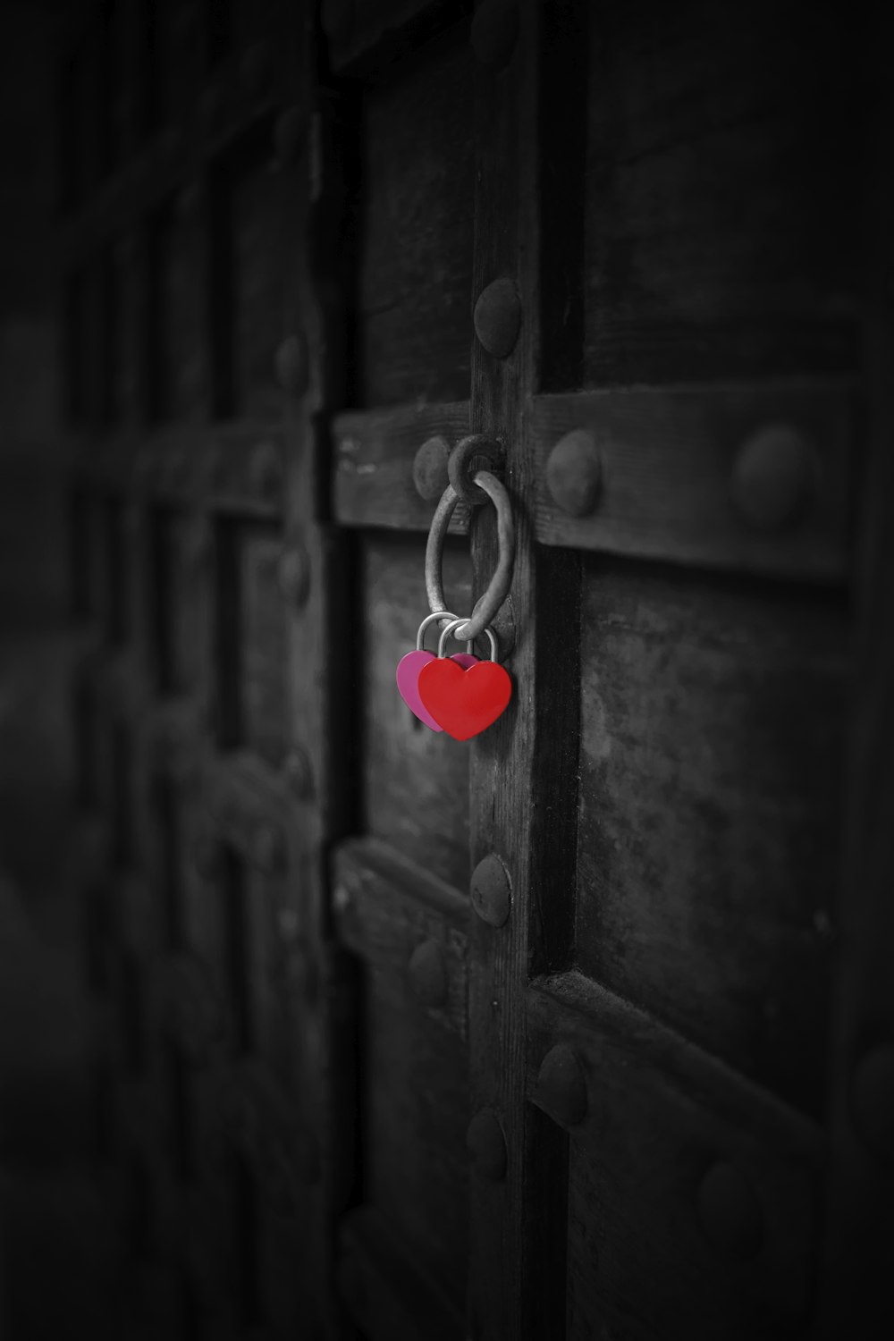 red heart padlock on brown wooden door