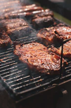 grilled meat on black charcoal grill