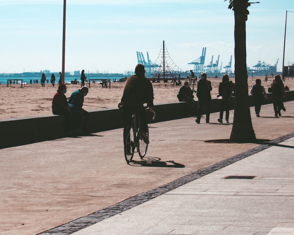 people walking on the beach during daytime