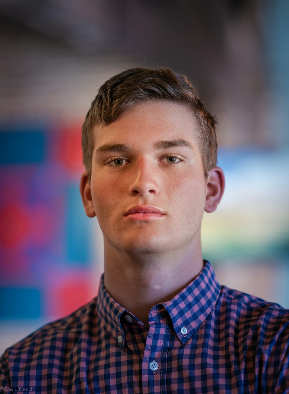 man in blue and white checkered dress shirt