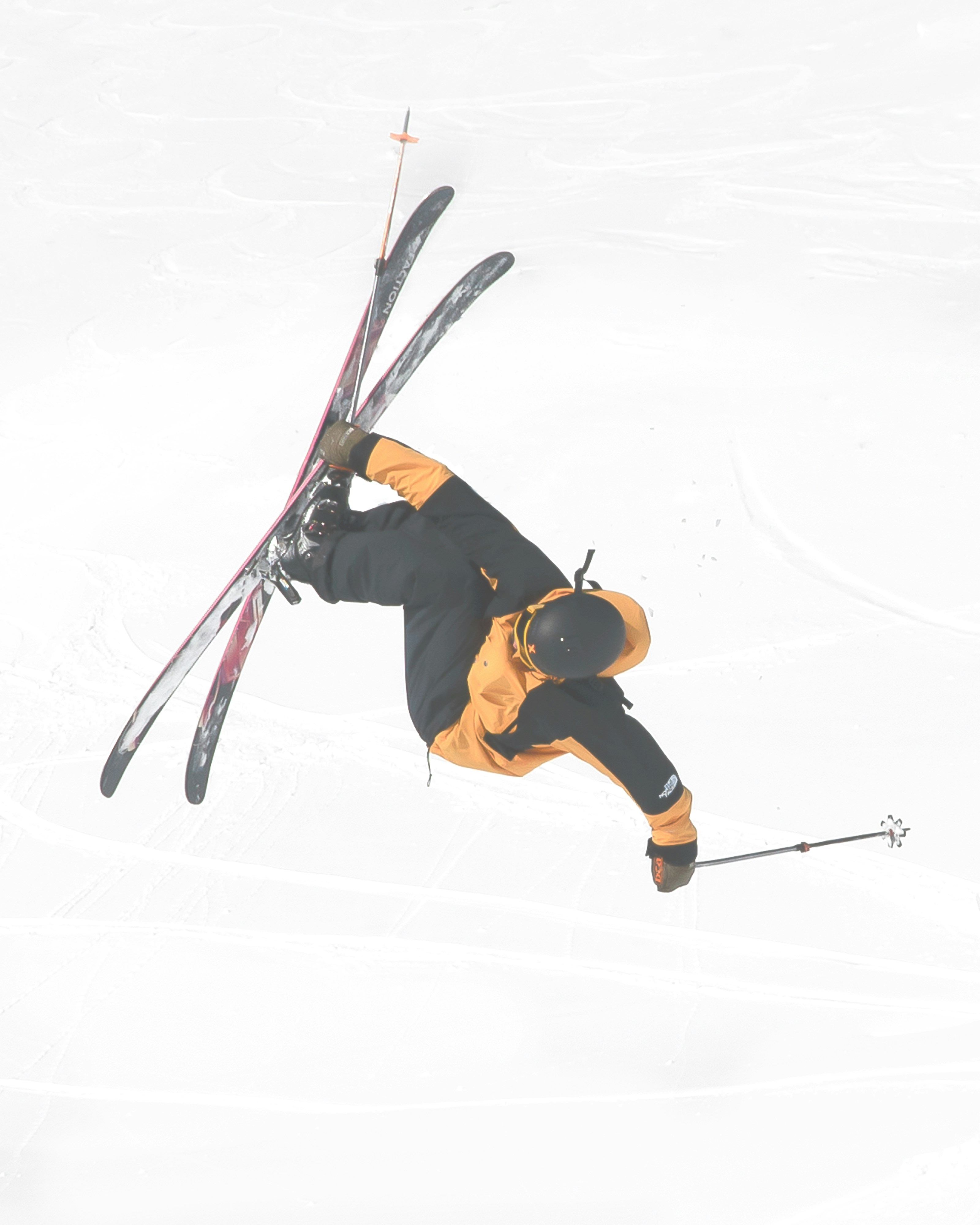 a man flying through the air while riding skis