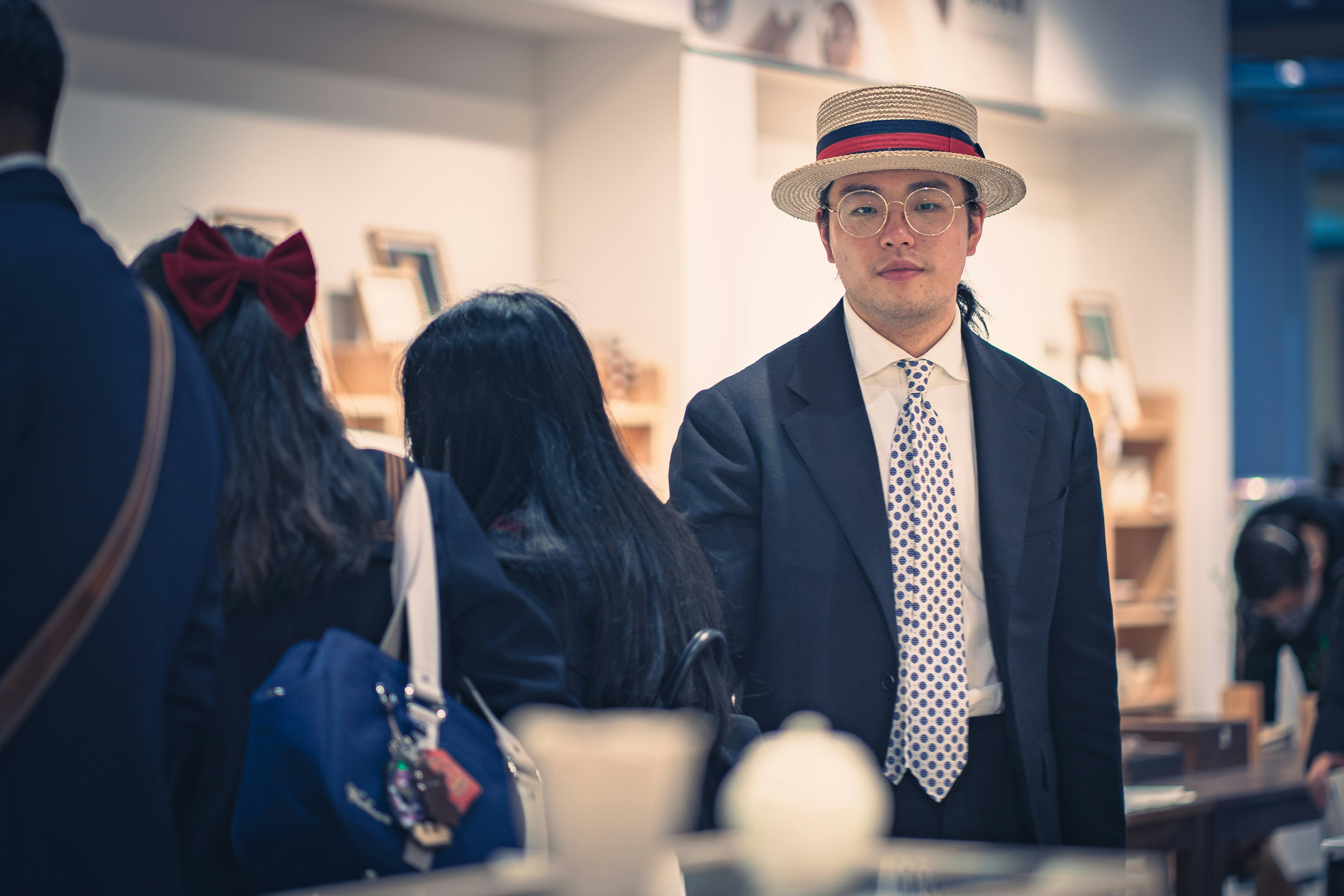 man in black suit standing beside woman in black long sleeve shirt