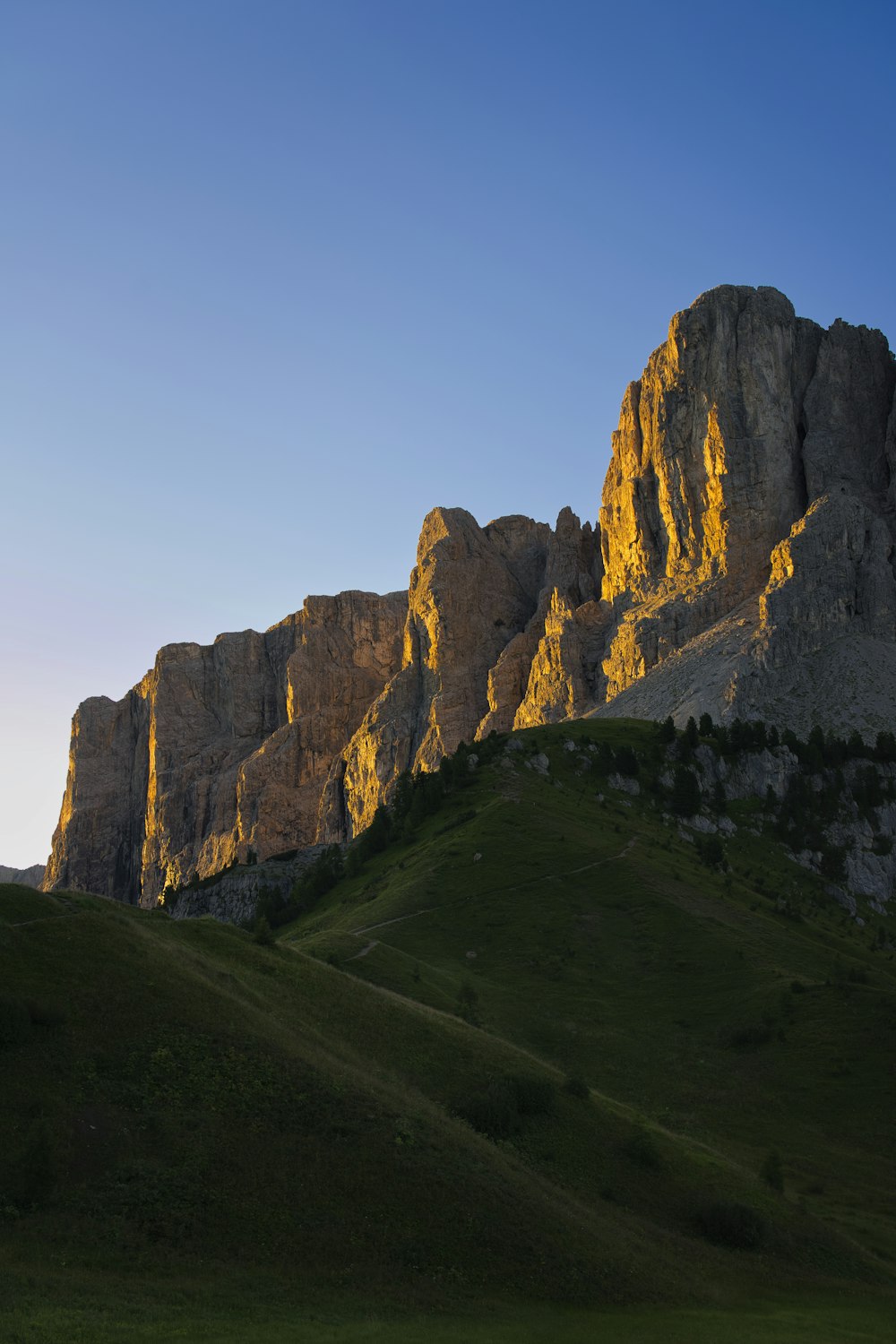 brown rocky mountain under blue sky during daytime