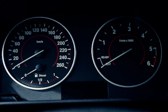 A close-up of a car dashboard displaying two circular gauges. The left gauge displays speed in km/h, ranging from 0 to 260, with a fuel indicator below marked for diesel. The right gauge shows engine revolutions per minute, ranging from 0 to 6, with 'READY' and 'OFF' indicators.