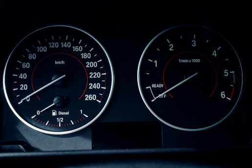 A close-up of a car dashboard displaying two circular gauges. The left gauge displays speed in km/h, ranging from 0 to 260, with a fuel indicator below marked for diesel. The right gauge shows engine revolutions per minute, ranging from 0 to 6, with 'READY' and 'OFF' indicators.