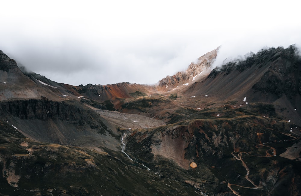 brown and gray mountains under white sky during daytime