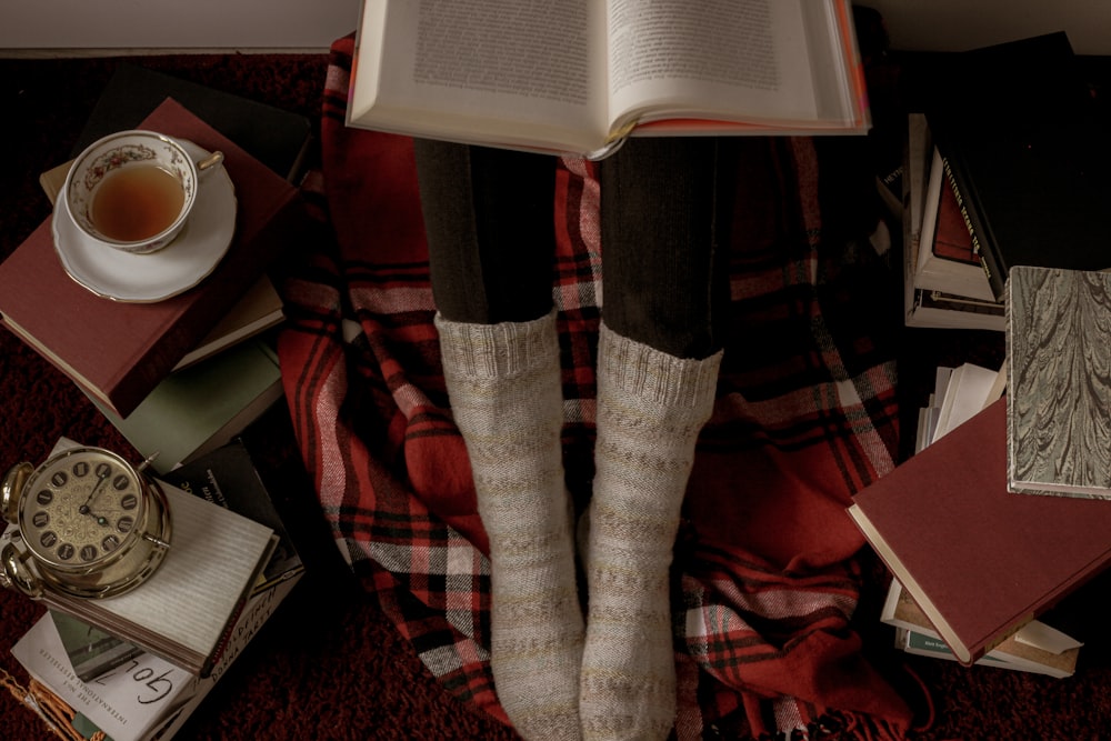 person in red and black plaid pants and white socks