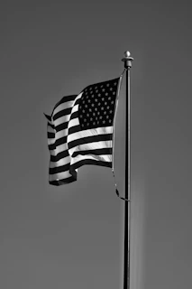 grayscale photo of us a flag