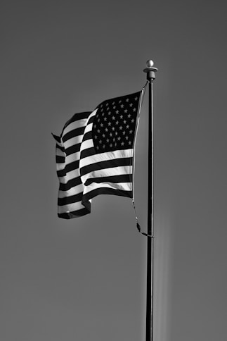 grayscale photo of us a flag