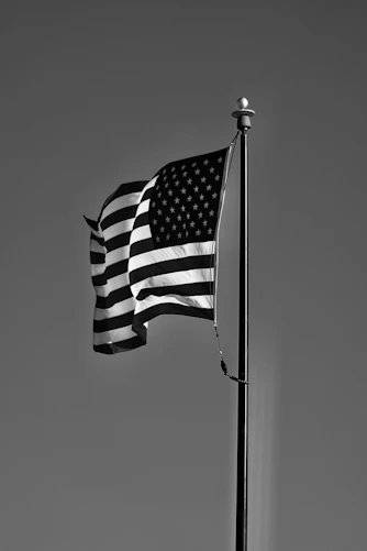 grayscale photo of us a flag