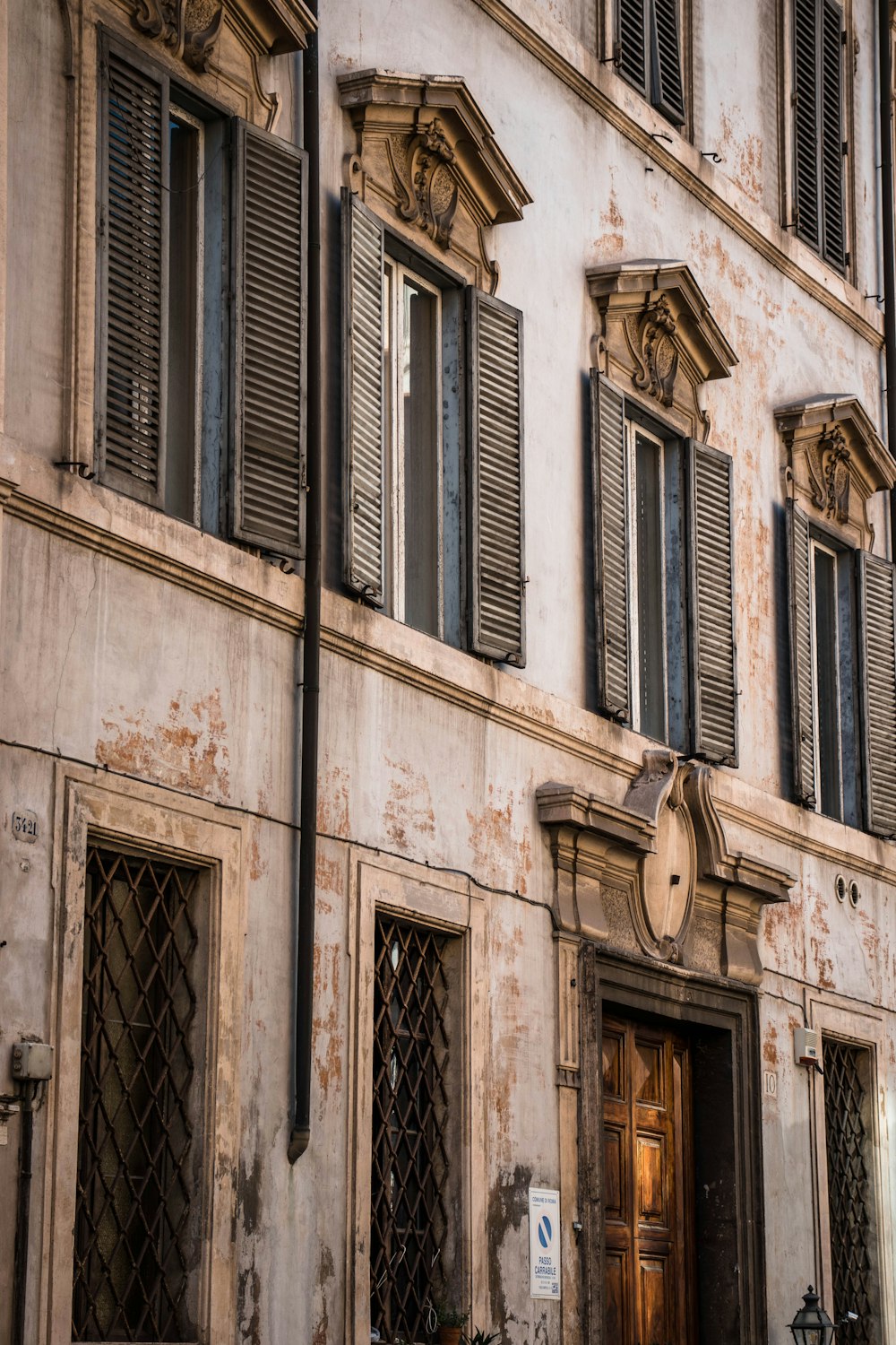 brown concrete building with windows