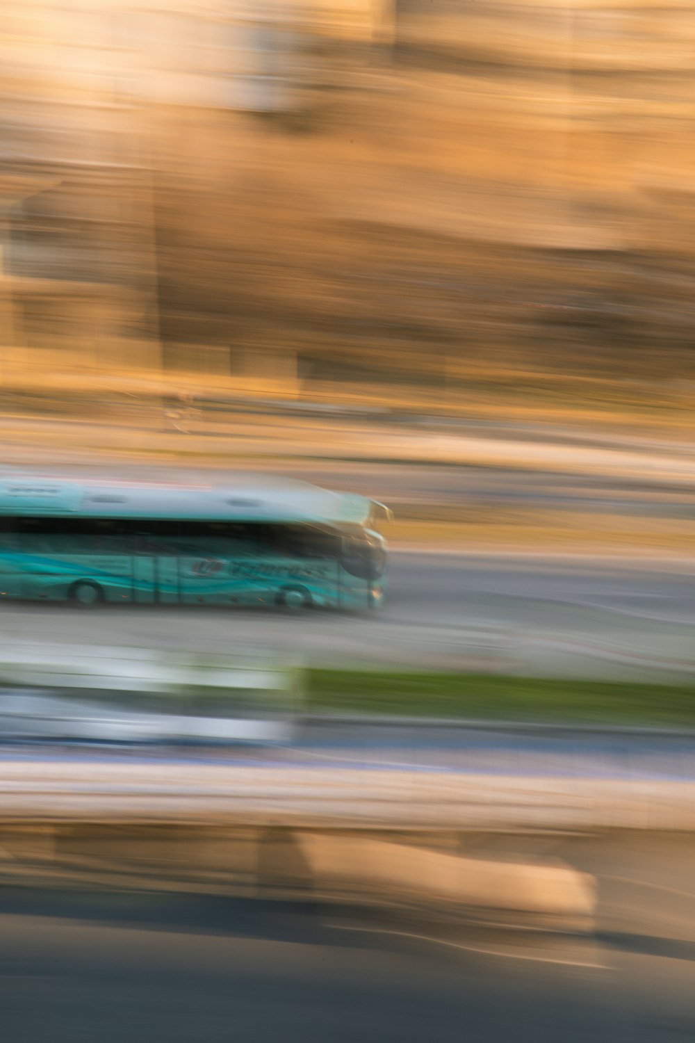 green and white bus on road