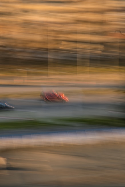 Action-packed scene from a fast-paced mobile racing game showing dynamic motion blur