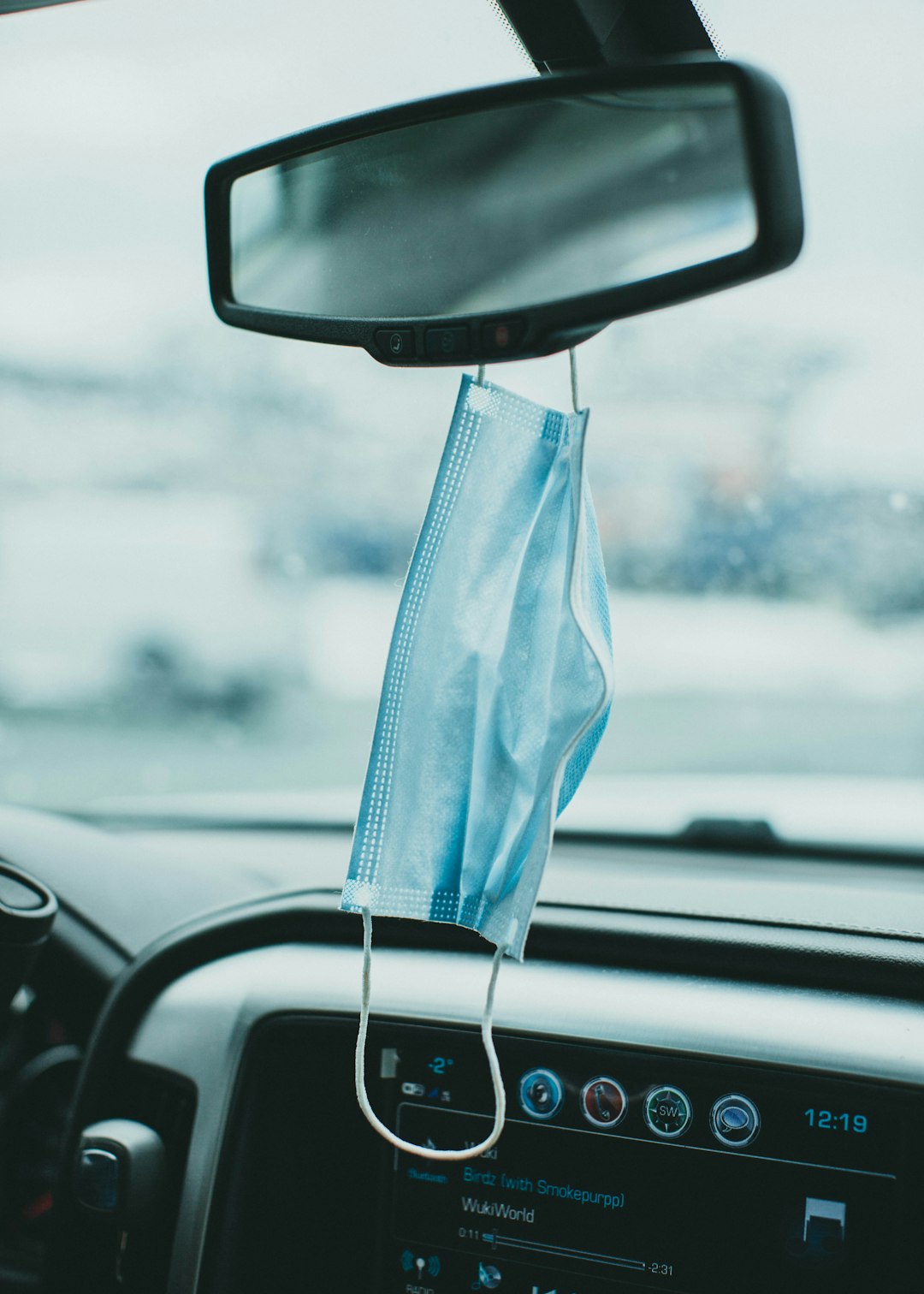 blue textile on car rear mirror