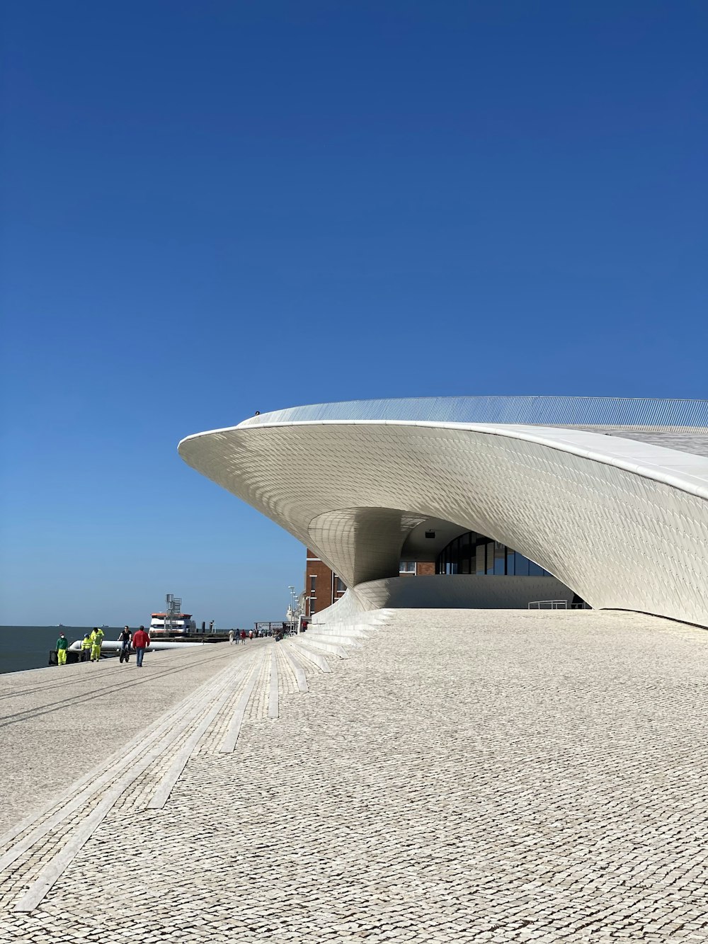 white concrete building under blue sky during daytime