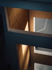 Architectural detail of a modern building emphasizing shadows and light.