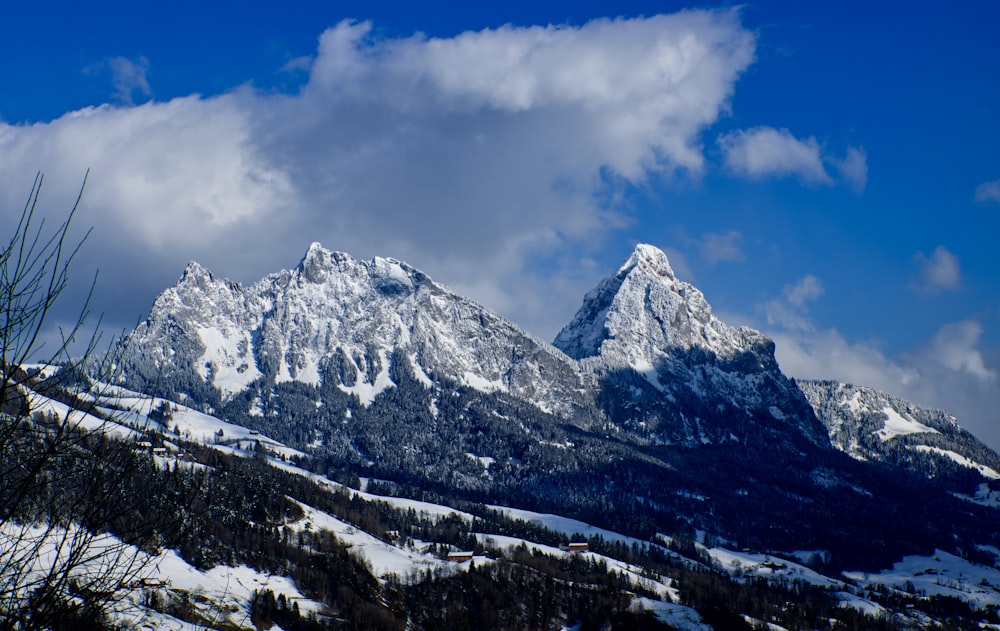 snow covered mountain under blue sky during daytime