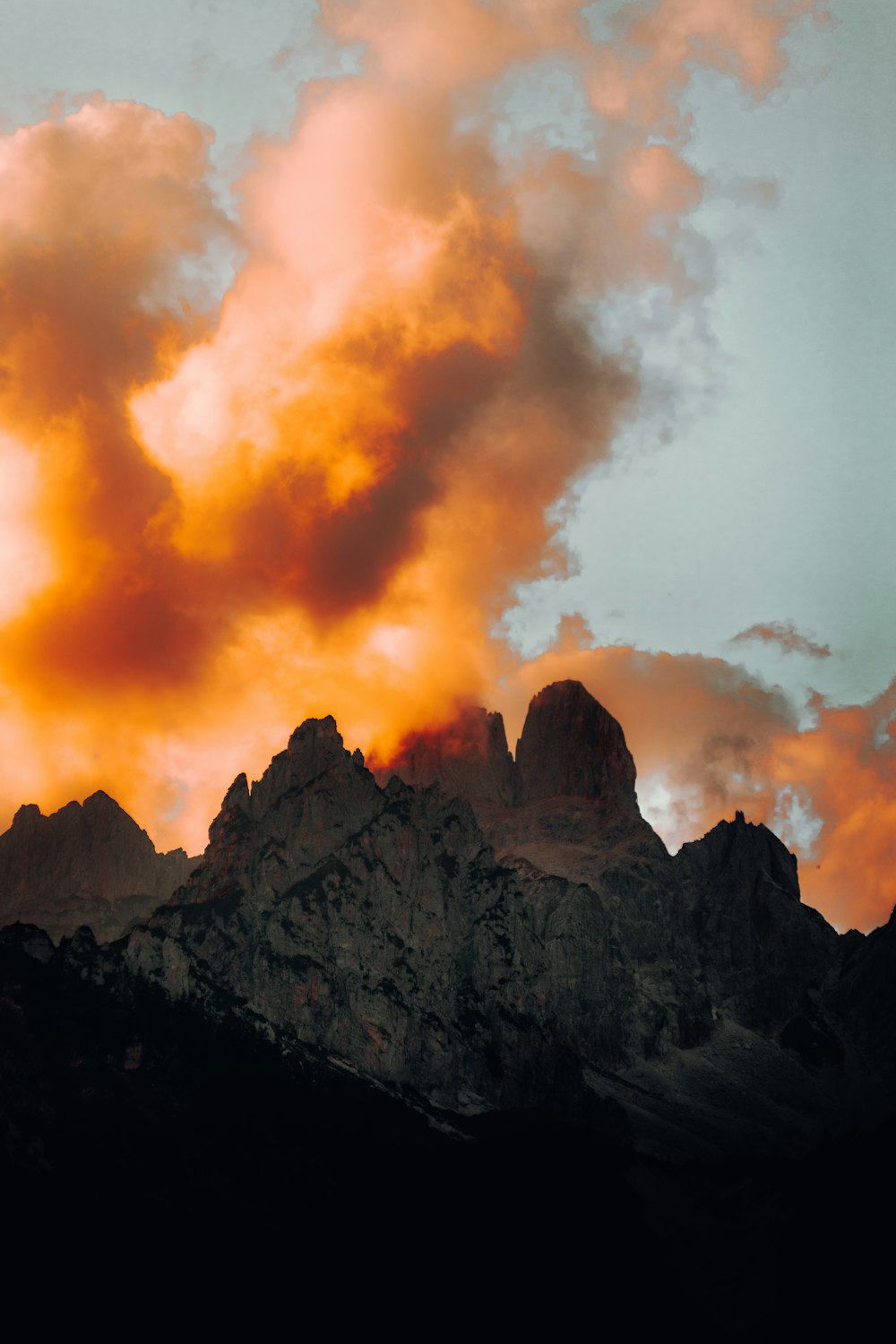 brown rocky mountain under white clouds