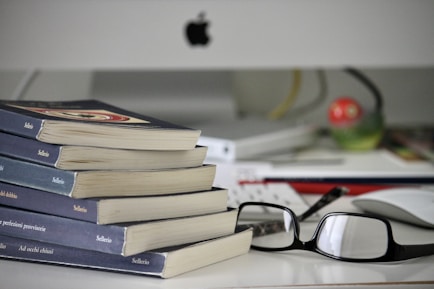 black framed eyeglasses on books