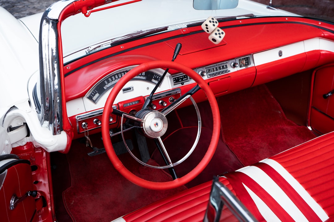 red and white car steering wheel