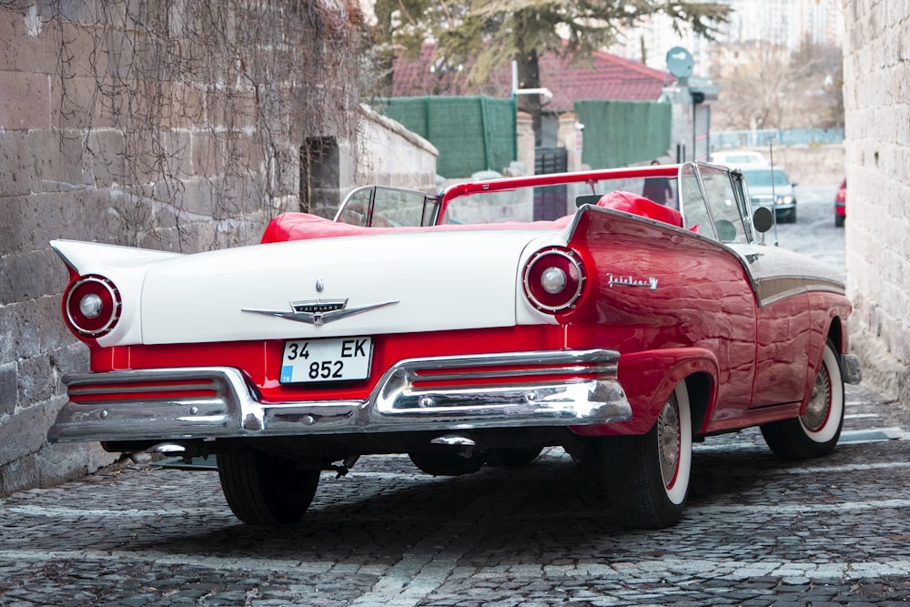 red classic car on road during daytime