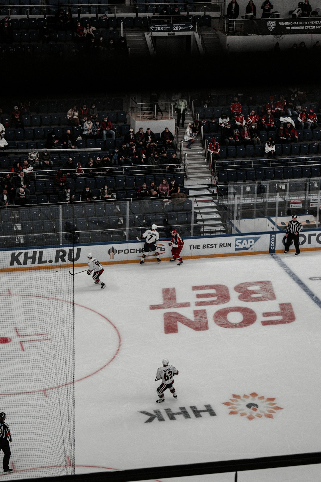 people playing ice hockey on stadium
