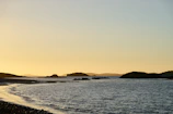 A serene coastal landscape at sunset along the shores of Santa Catarina.