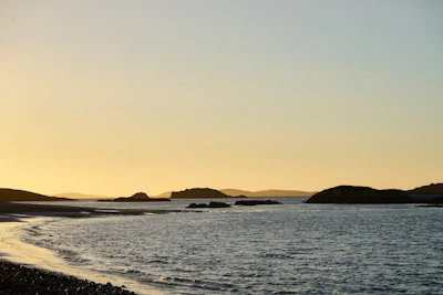 A serene coastal landscape at sunset along the shores of Santa Catarina.