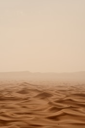desert under white sky during daytime