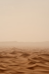 desert under white sky during daytime