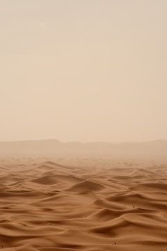 desert under white sky during daytime
