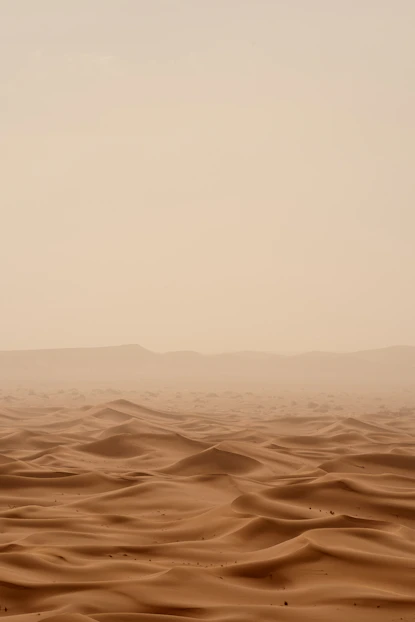 desert under white sky during daytime