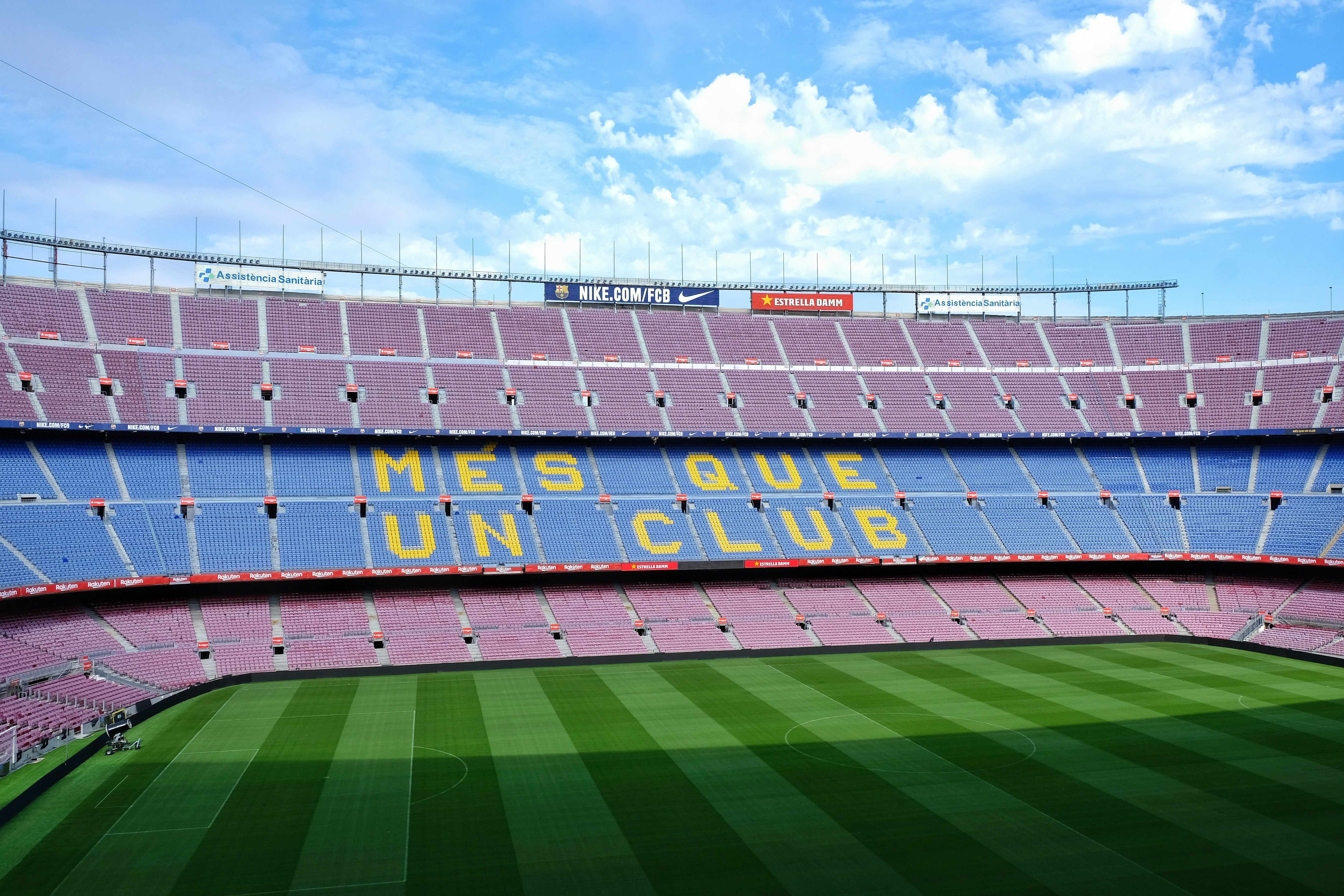 soccer field under blue sky during daytime, The Camp Nou, home of FC Barcelona