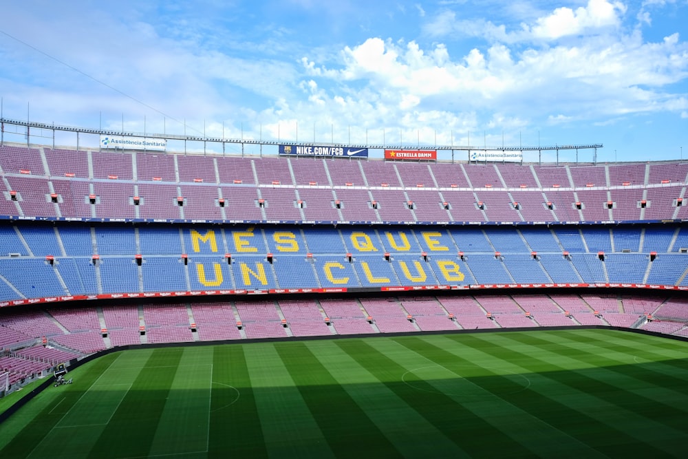 soccer field under blue sky during daytime