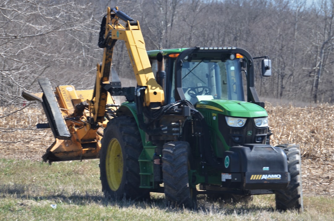 green and yellow front loader