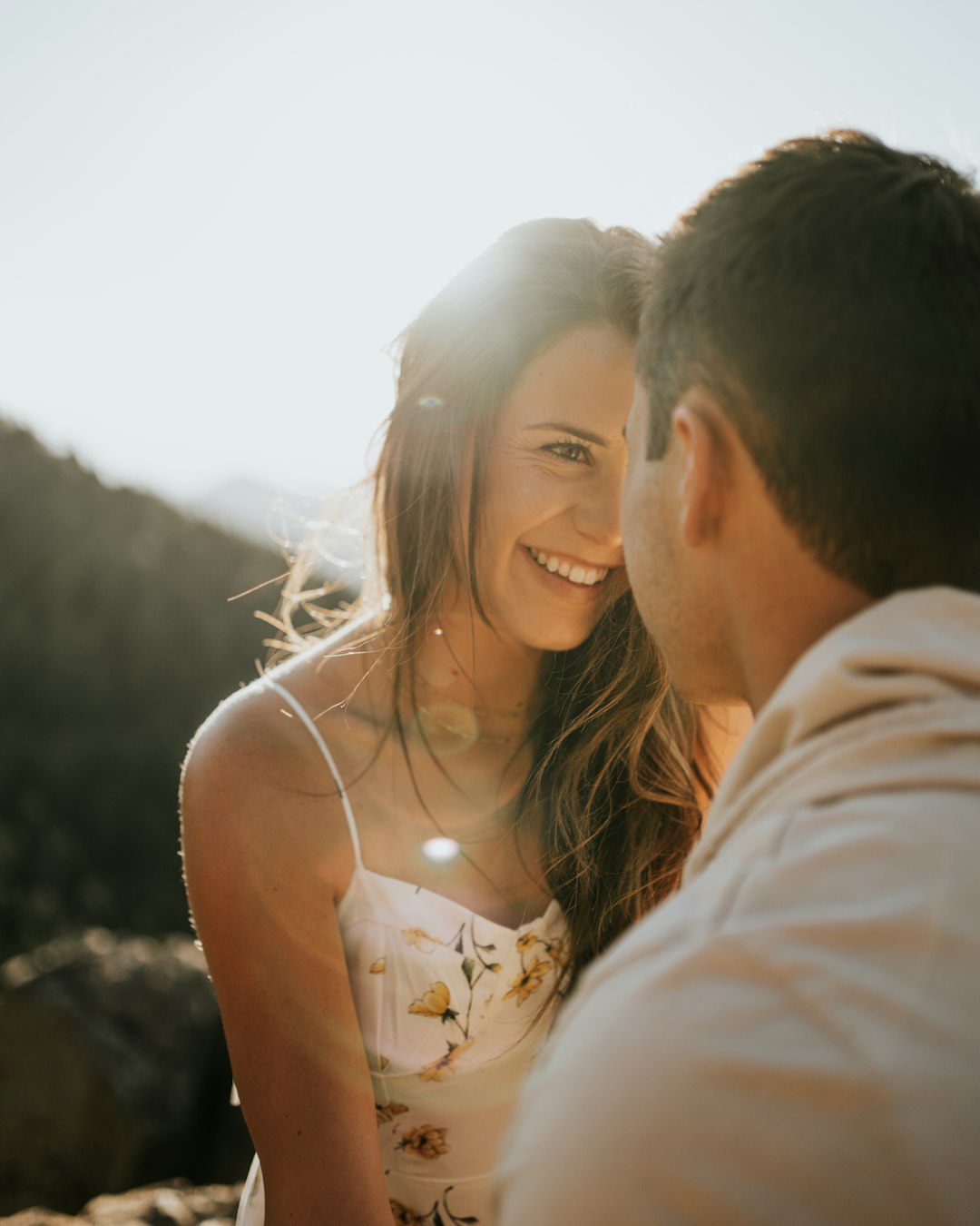 man and woman kissing during daytime