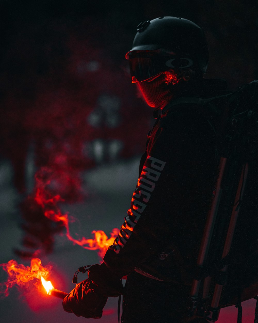 man in black hoodie smoking