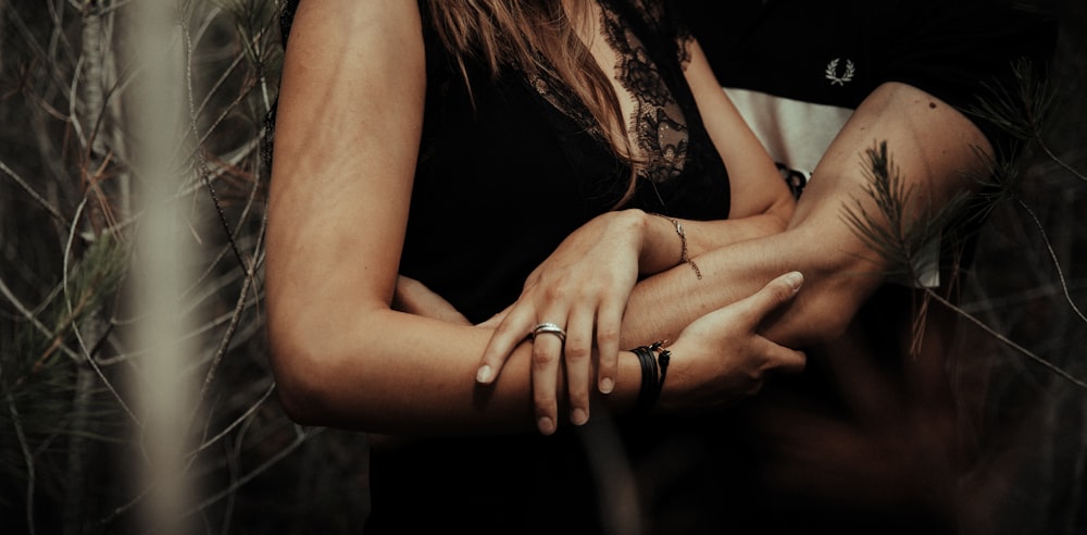 woman in black tank top wearing silver ring