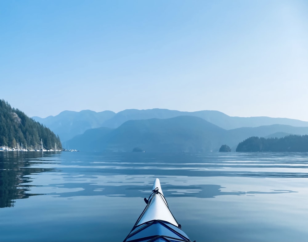 white and blue tent on lake during daytime