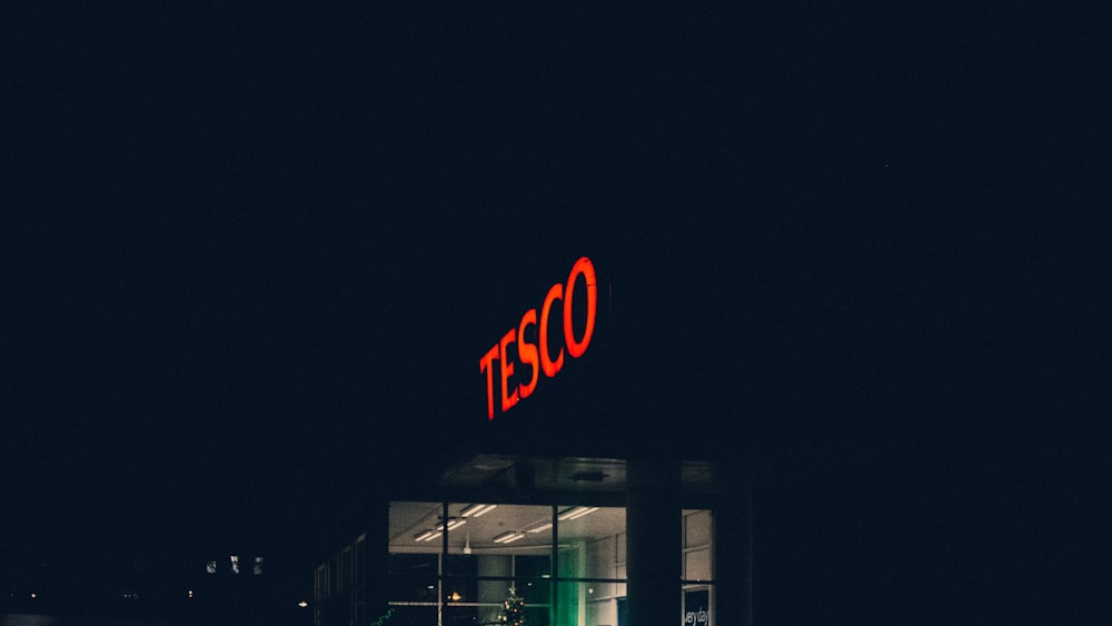 red and white open neon signage