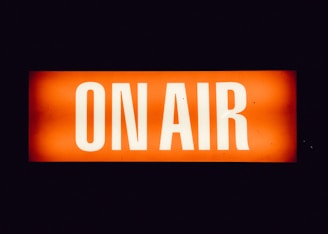 a close up of a street sign with a dark background