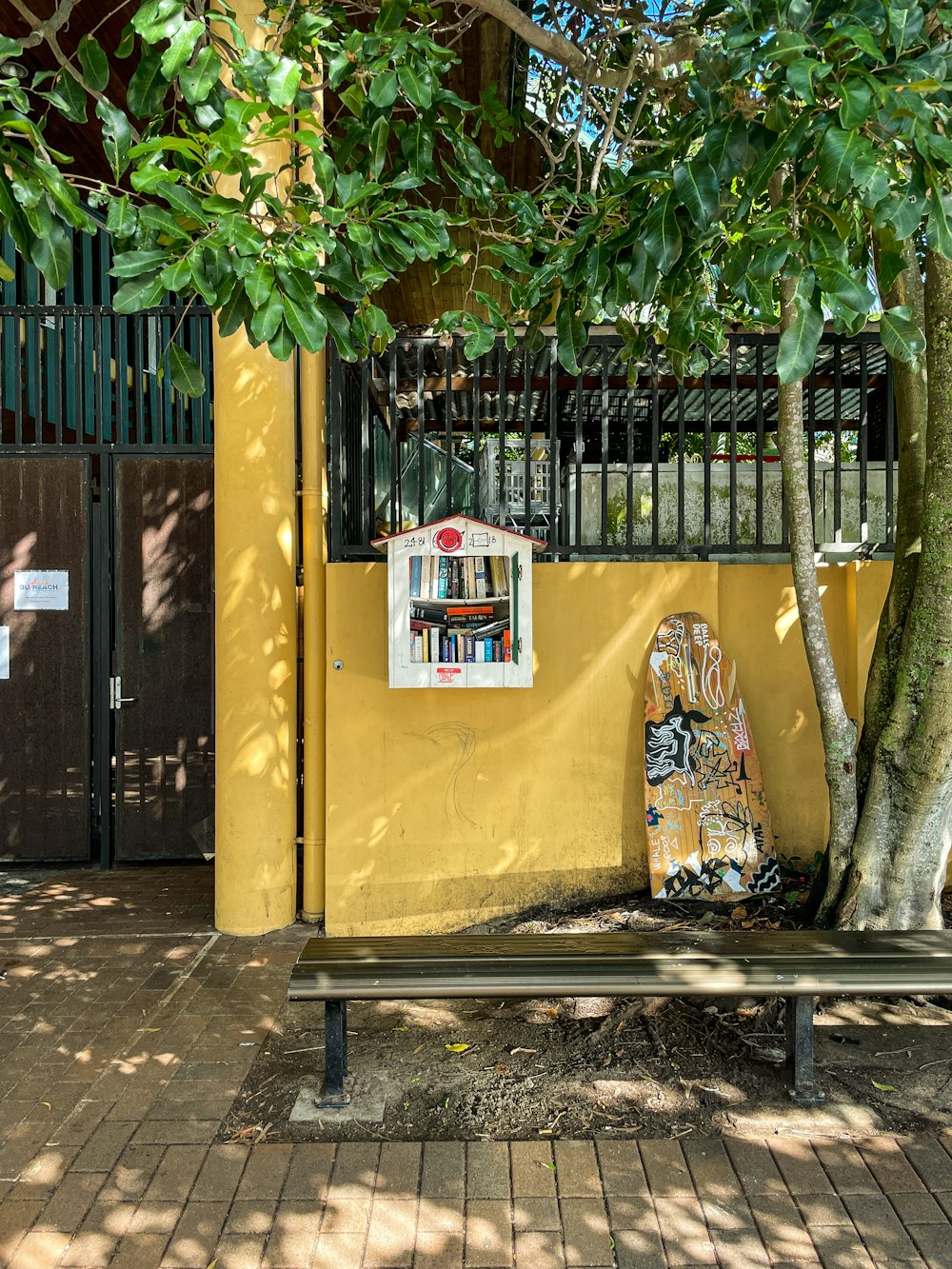 yellow and red telephone booth