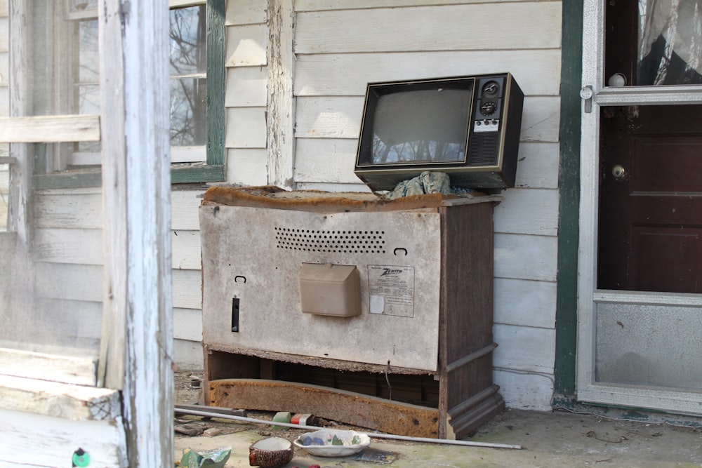 black crt tv on brown wooden table