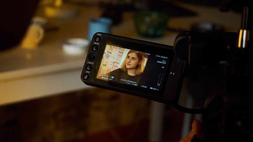 black sony smartphone displaying woman in black shirt