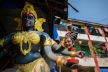 gold and red hindu deity statue