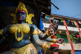 gold and red hindu deity statue
