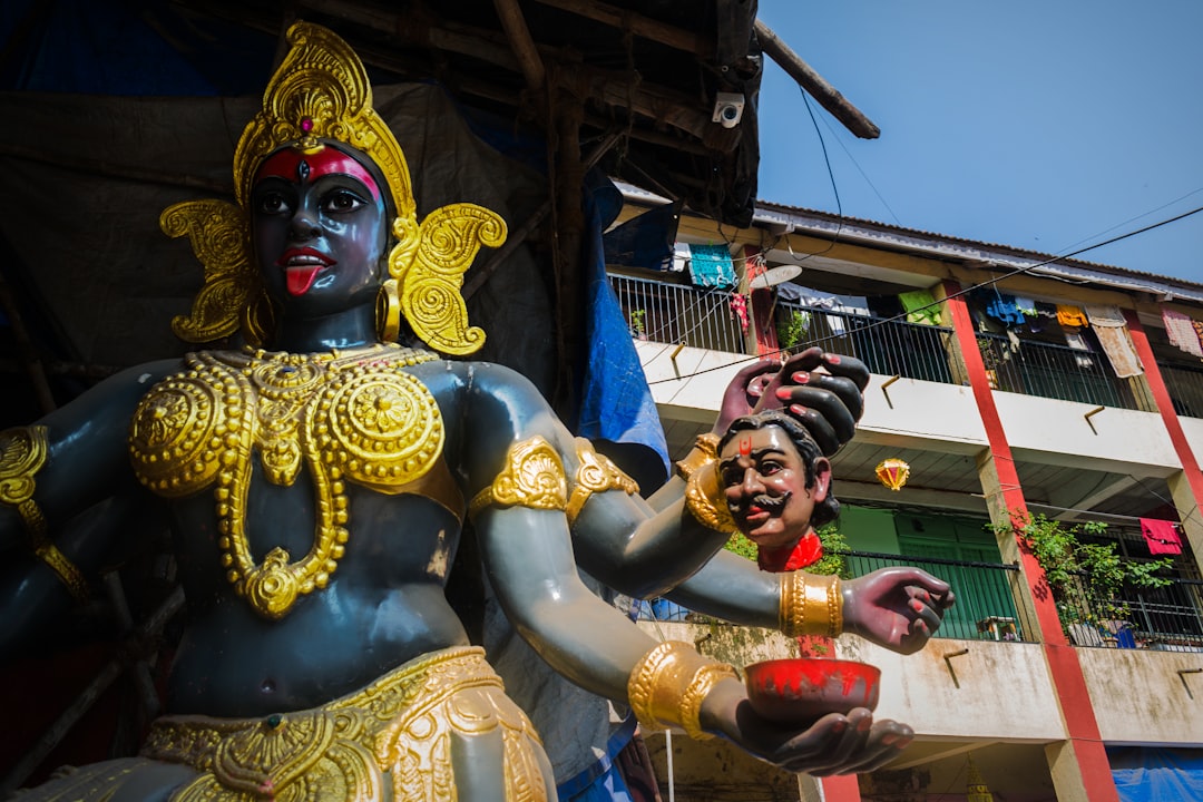 gold and red hindu deity statue, An idol of Goddess Kali at a workshop in Mumbai during Navratri.</p><p>