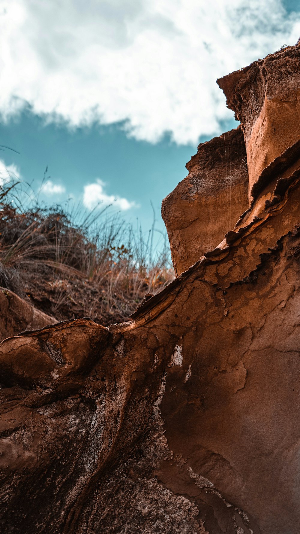 brown rock formation under blue sky during daytime