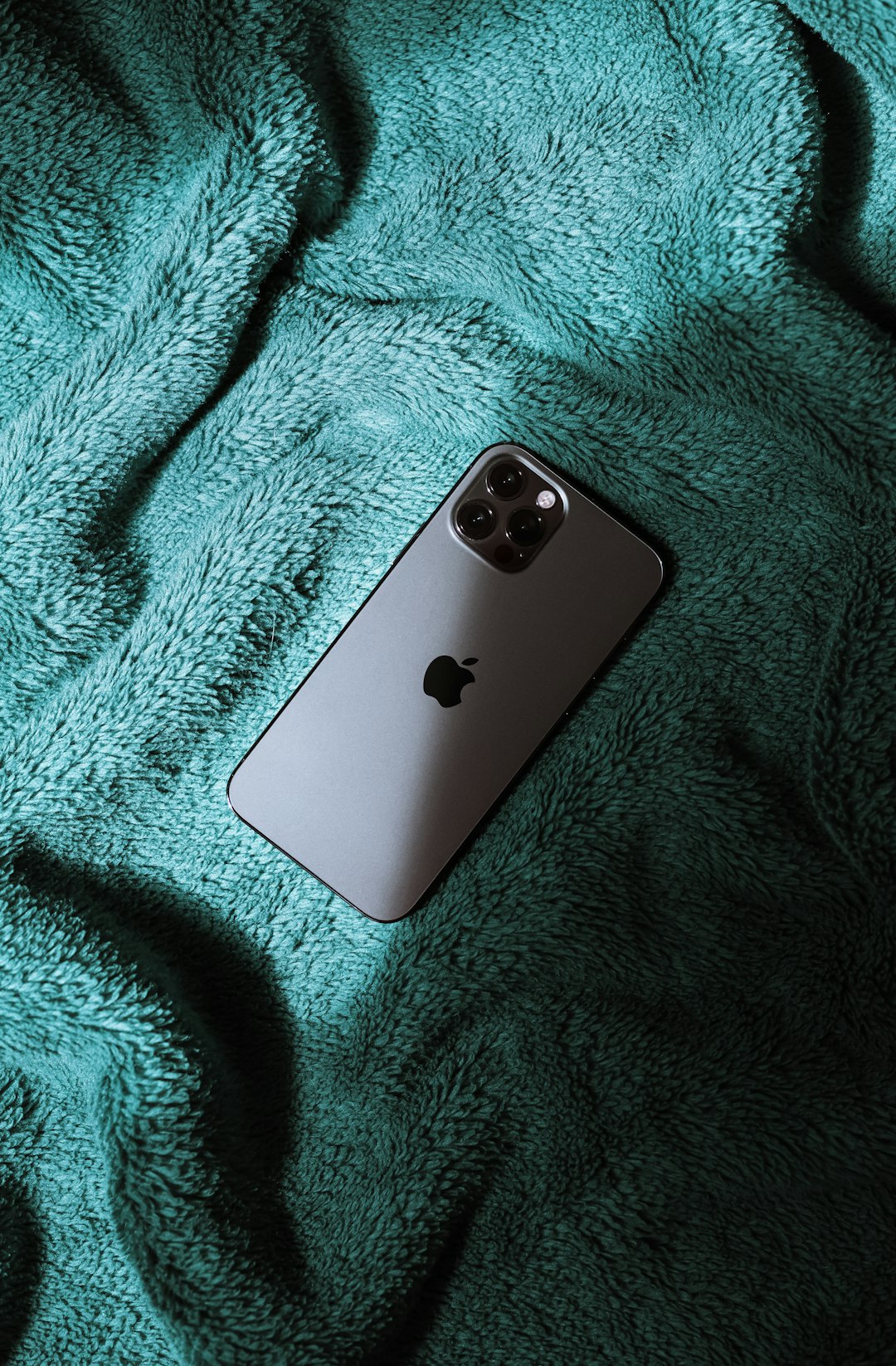 silver iphone 6 on blue textile