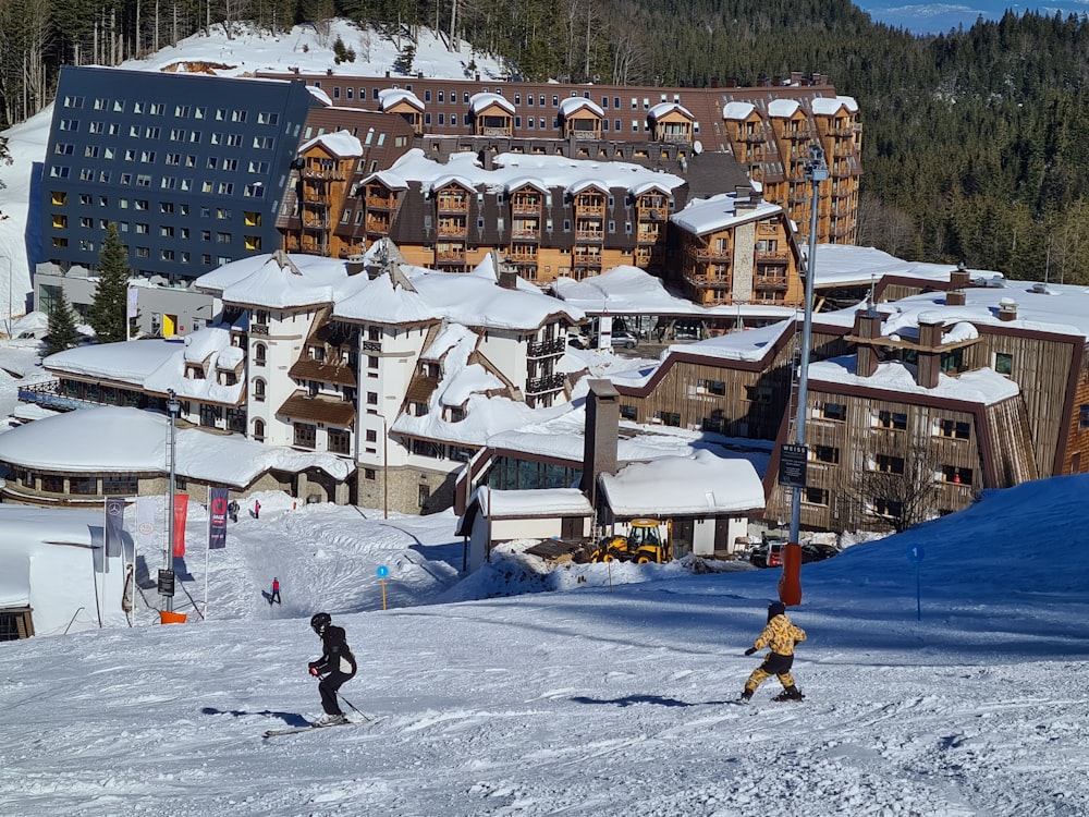 people walking on snow covered field during daytime